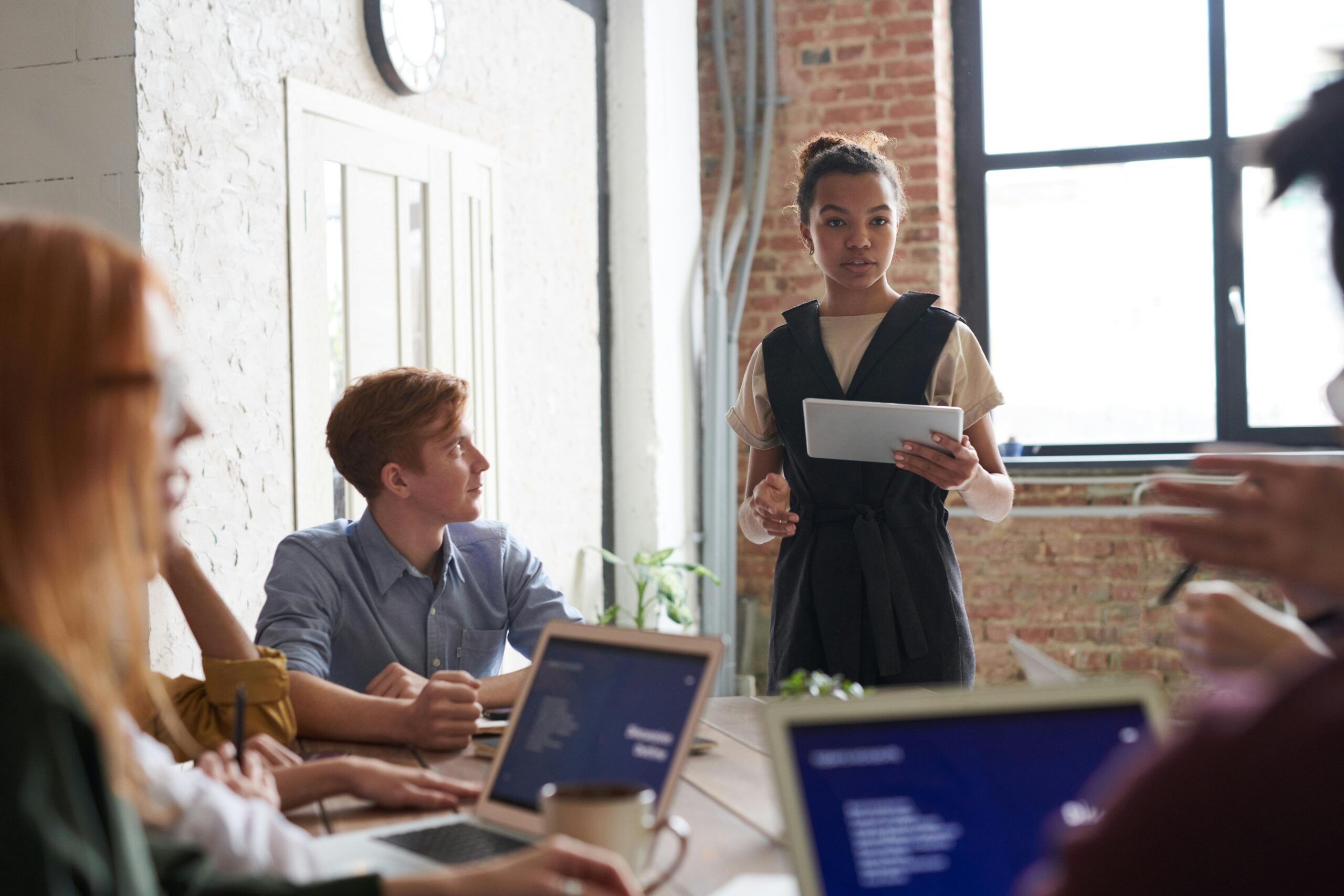 Business team engaged in a collaborative meeting in a modern office setting.